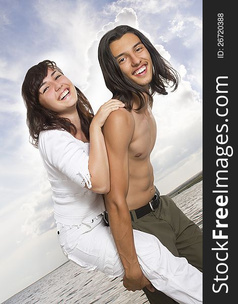 Happy young couple on the sea. Happy young couple on the sea