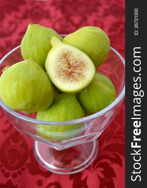 Figs in a bowl, with red background