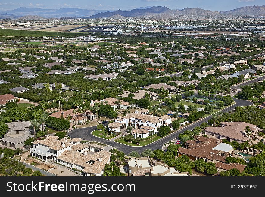 Upscale Homes scattered amongst citrus and Palms near Falcon Field Airport in Mesa, Arizona. Upscale Homes scattered amongst citrus and Palms near Falcon Field Airport in Mesa, Arizona