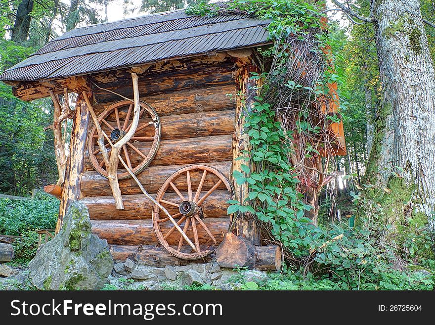 Traditional wooden house made ​​of logs in the forest. Traditional wooden house made ​​of logs in the forest.