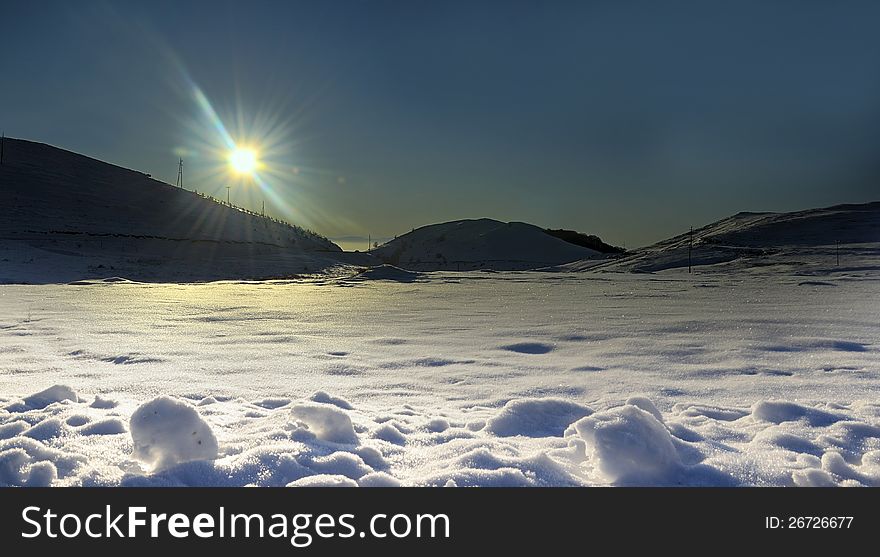Sun shine on the snow horizon of the mountain. Sun shine on the snow horizon of the mountain