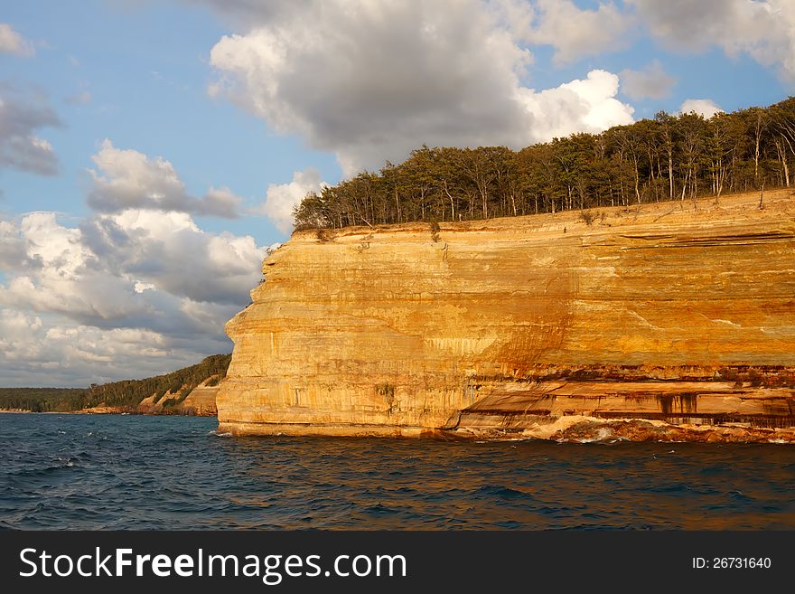 Pictured Rocks National Lakeshore in evening sunlight.These colorful formations are on the Lake Superior shoreline on Michigan's Upper Peninsula.