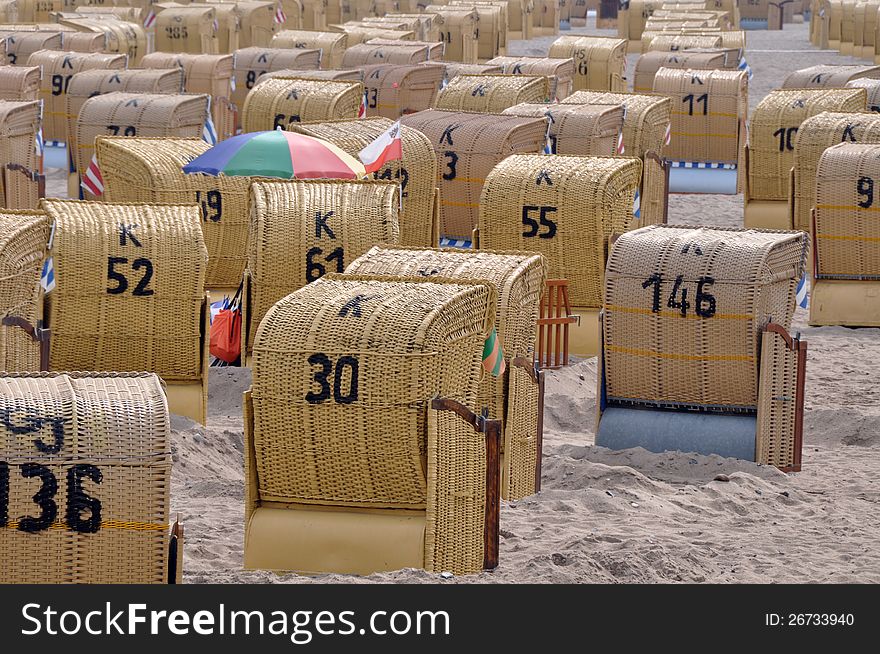 Roofed wicker beach chairs