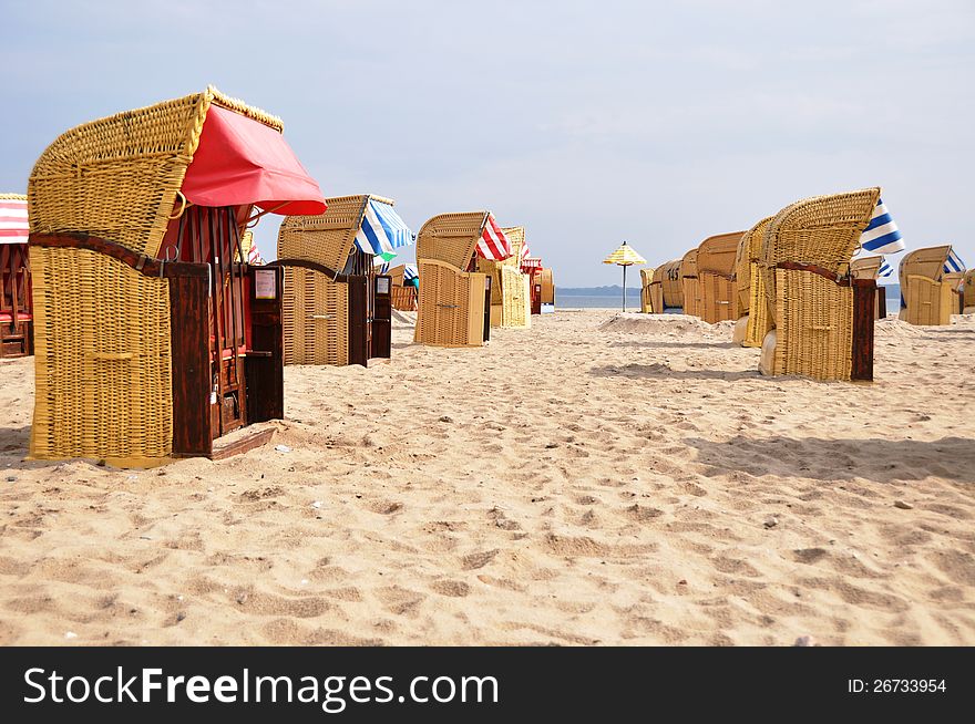 Many roofed wicker beach chairs at the beach