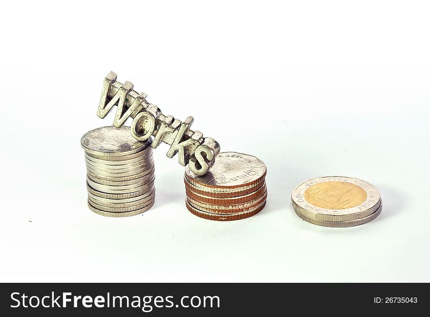 Words of works steel letter climbs on stack of coins isolated. Words of works steel letter climbs on stack of coins isolated