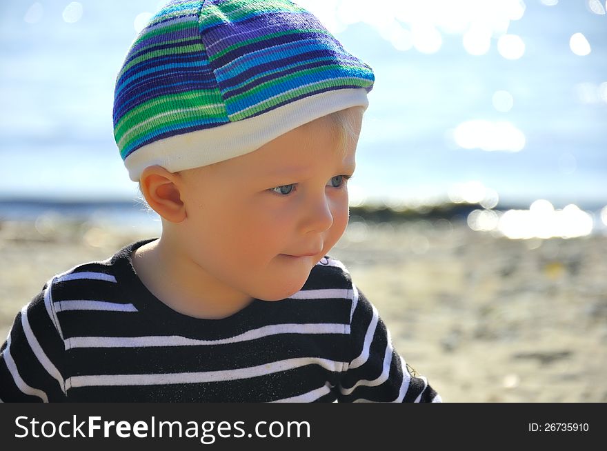 Cute small boy playing on a beach. Cute small boy playing on a beach