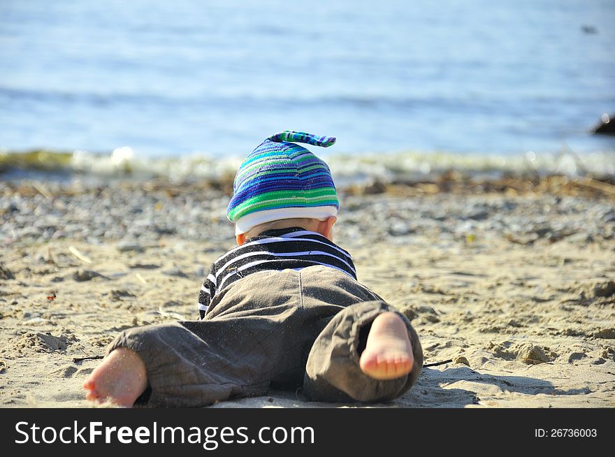 Cute small boy playing on a beach. Cute small boy playing on a beach