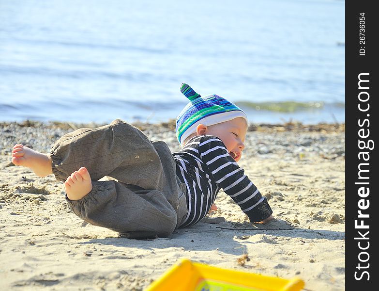 Cute small boy playing on a beach. Cute small boy playing on a beach