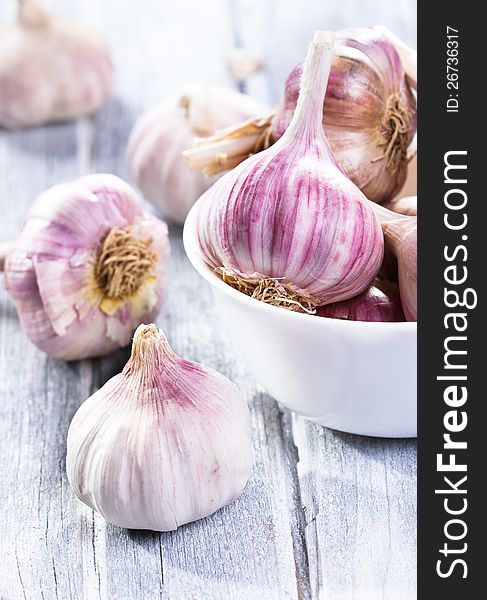 Fresh garlic on wooden table