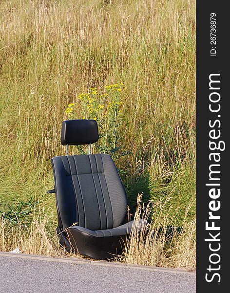 Pollution car seat on the roadside