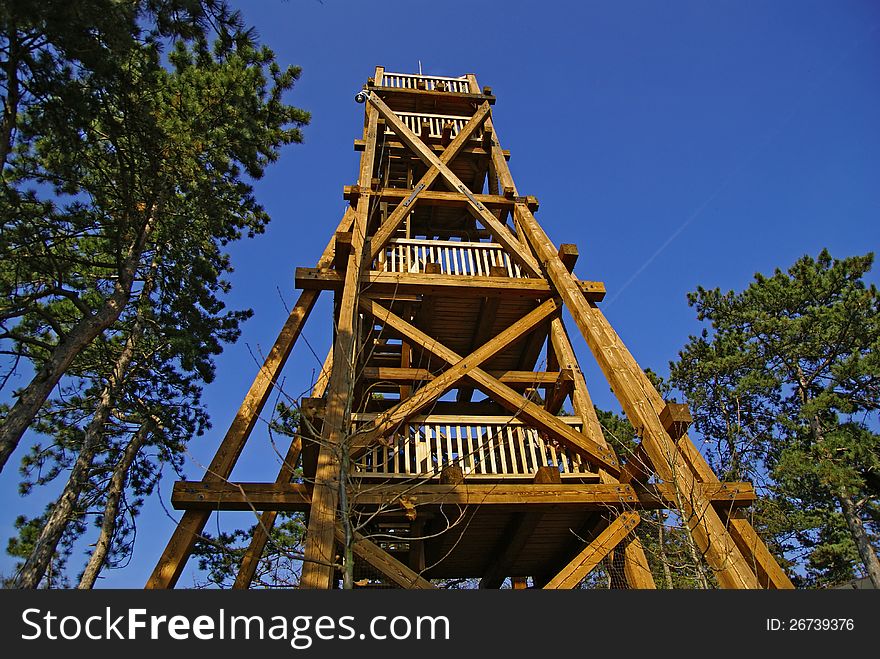 Lookout tower made of wood situated in the countryside. Lookout tower made of wood situated in the countryside