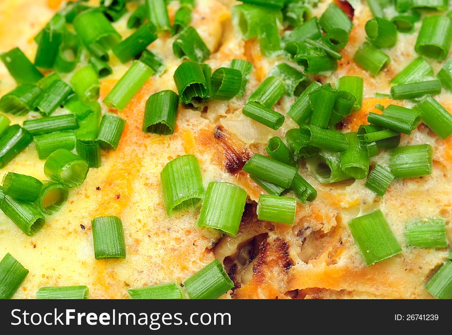 Chopped spring onions on top of omelet