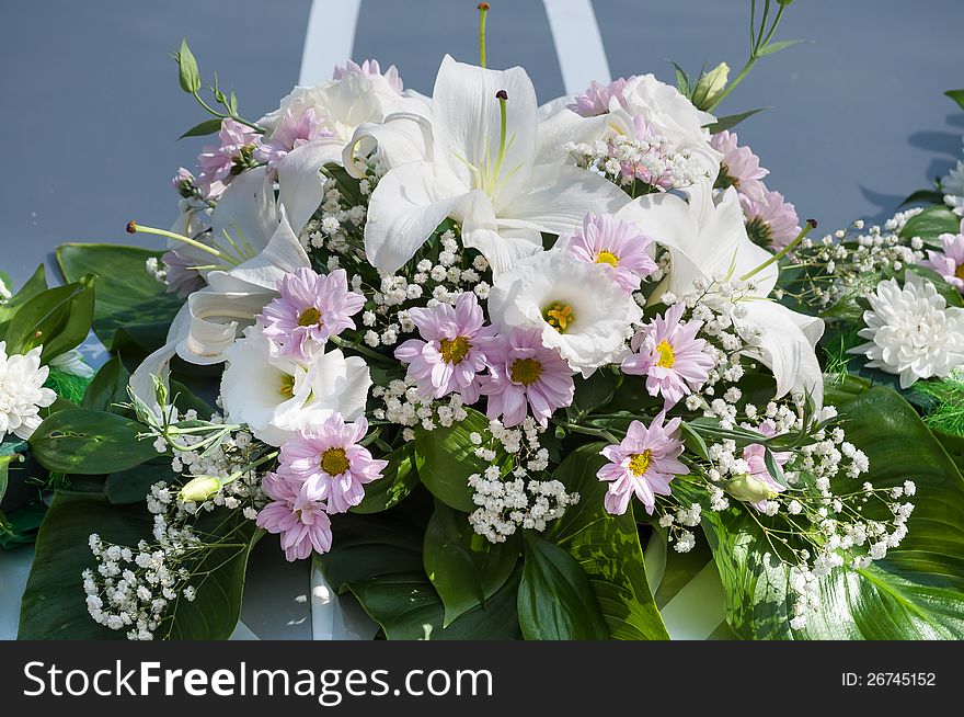 Wedding car decoration with bouquet of flowers