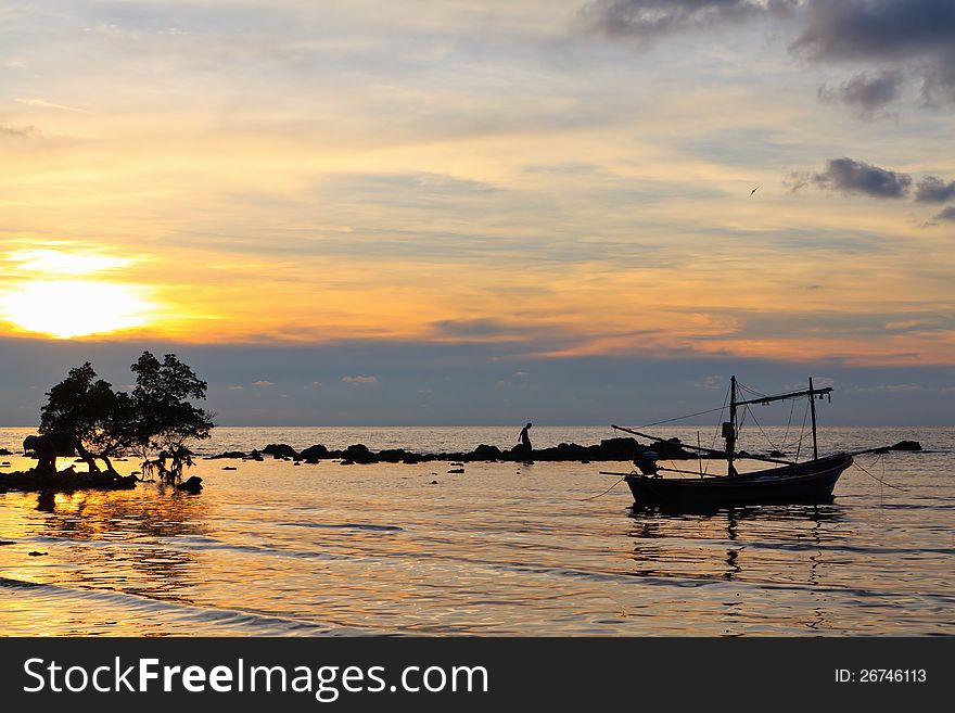 Boat In The Sea At Sunset.