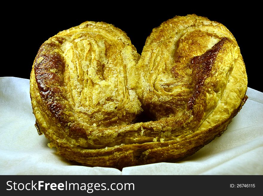 Palm-shaped pastry on table. Palm-shaped pastry on table