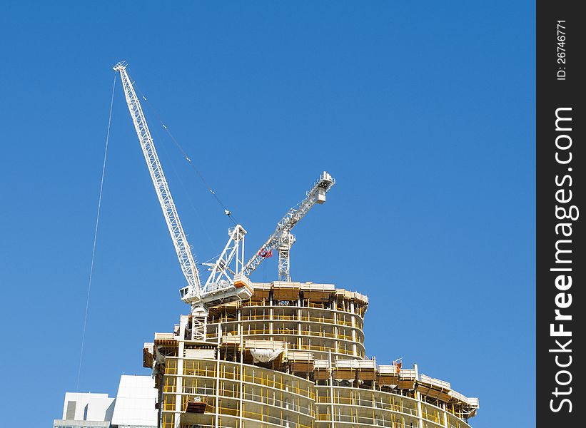 Condominium tower under construction with crane. Condominium tower under construction with crane