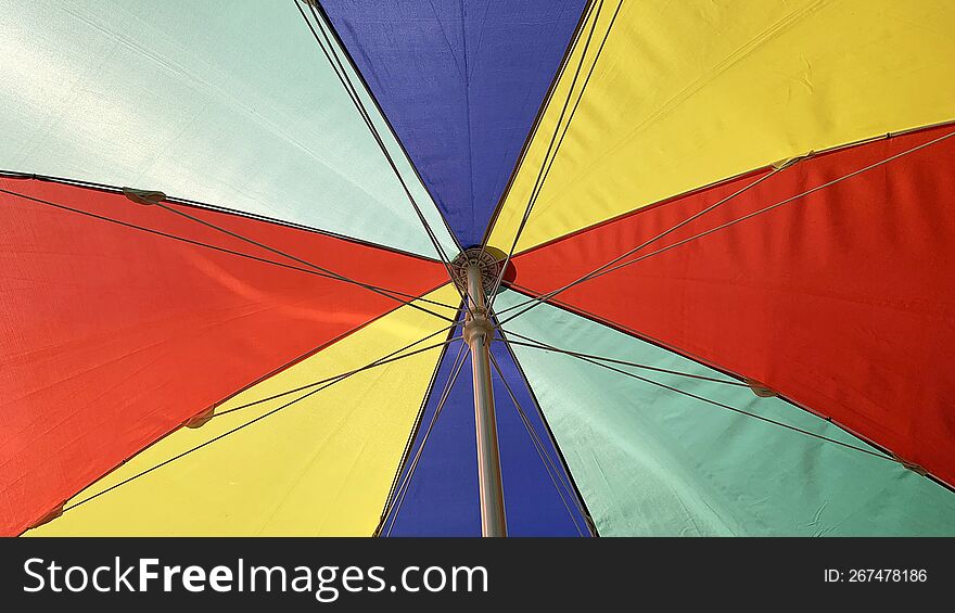 Colorful section of an umbrella on the street
