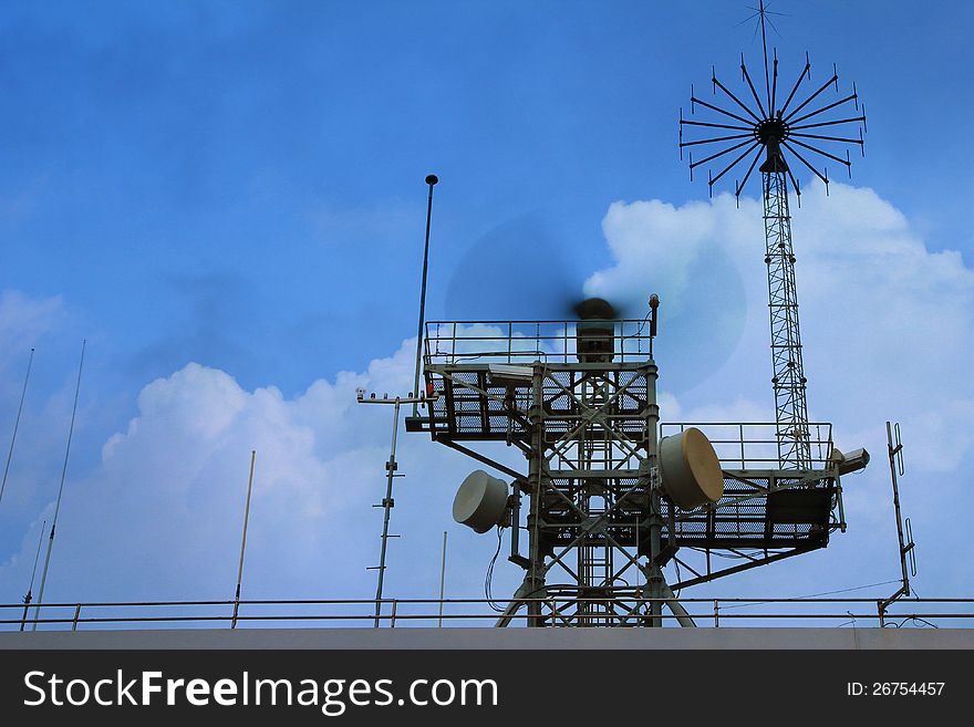 Radar tower at industrial harbor in evening sky. Radar tower at industrial harbor in evening sky