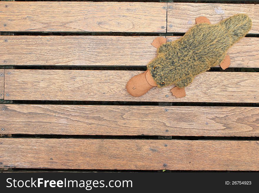 Old wooden background with doll