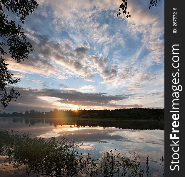 Sunrise over the river. The first rays of sun.