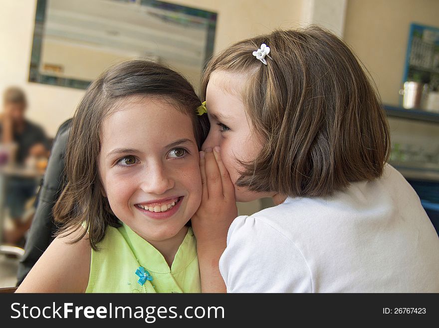 Sisters Whispering On The Ear