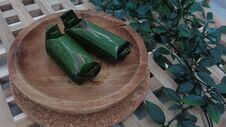 Kue Lemper Is A Typical Indonesian Food Consisting Mainly Of Sticky Rice Filled With Chicken And Rolled In Banana Leaves Stock Images