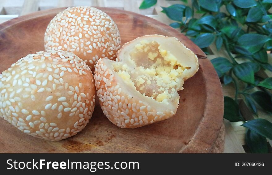 Onde-onde is a traditional Indonesian cake made from glutinous rice flour and filled with sweet green beans