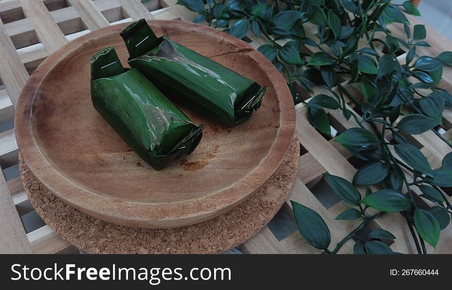 Kue lemper is a typical Indonesian food consisting mainly of sticky rice filled with chicken and rolled in banana leaves