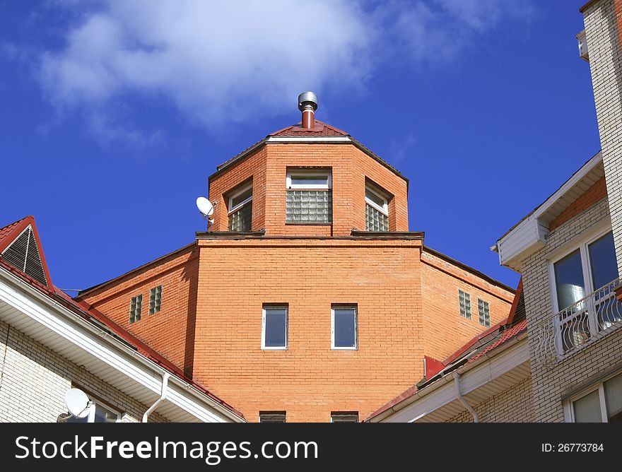 Photo of big protected modern house against blue sky. Photo of big protected modern house against blue sky