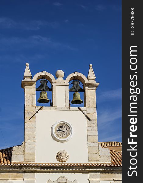 Clock tower with two bells. Clock tower with two bells.