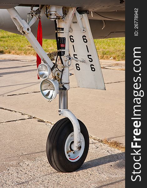 Close up of front wheel in military airplane. Close up of front wheel in military airplane