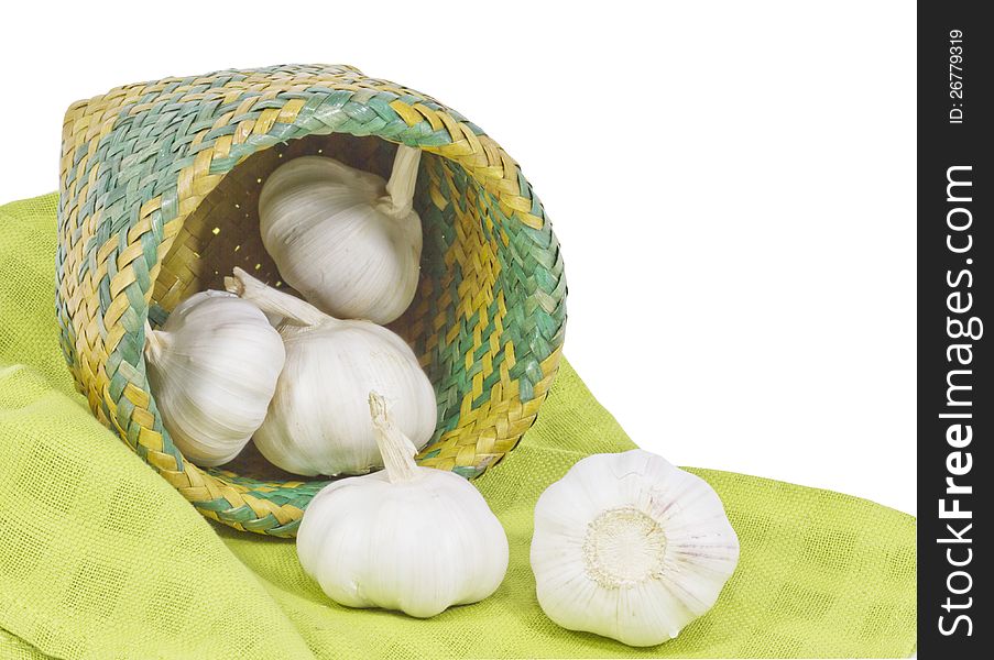 Basket of fresh garlic on white background. Basket of fresh garlic on white background