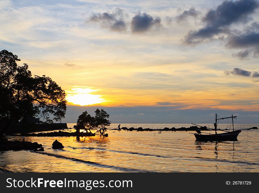 Boat In The Sea At Sunset.