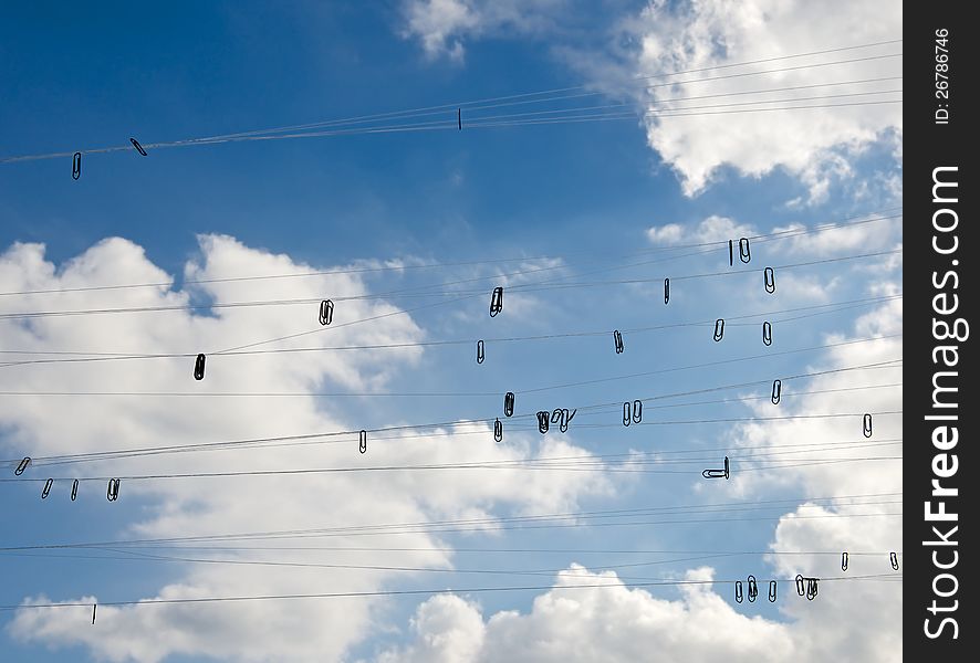 Against the background of the blue sky cloud visible fishing line hanging from her staples. This symbolizes instolyatsiya thoughts and ideas come to mind of man. Against the background of the blue sky cloud visible fishing line hanging from her staples. This symbolizes instolyatsiya thoughts and ideas come to mind of man.