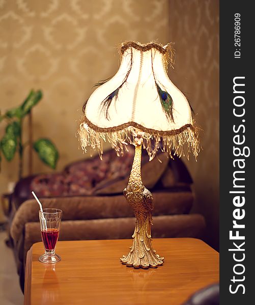 Table lamp in the form of a peacock