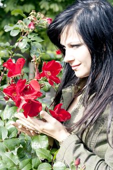 Beautiful Brunette Near Red Roses Stock Image Beautiful Brunette Near Red Roses Stock Image