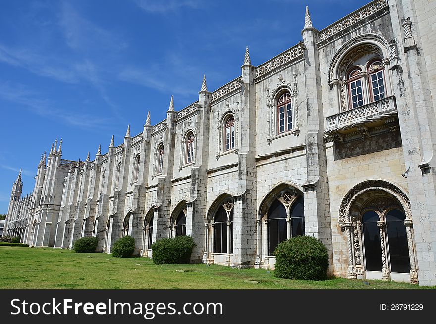 The elaborately ornamented facade of the ancient Monastery of Jeronimos in Lisbon, Portugal. The elaborately ornamented facade of the ancient Monastery of Jeronimos in Lisbon, Portugal