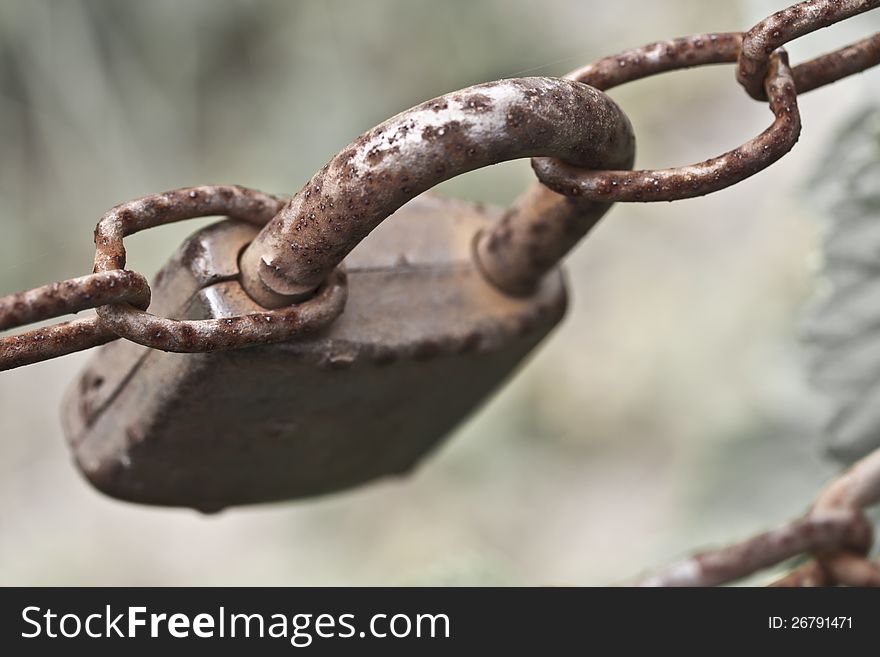 An old rusted lock & chain. An old rusted lock & chain