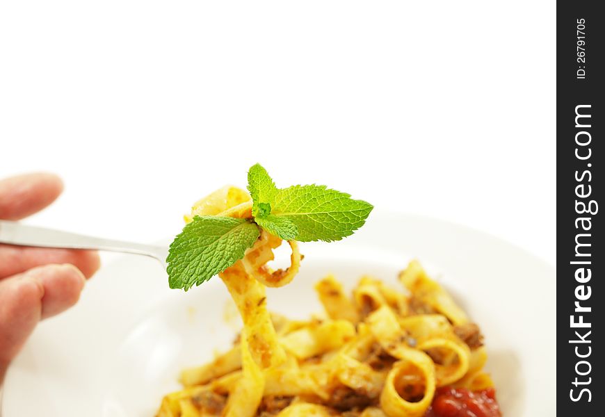 Pasta with meat sauce on towards white background