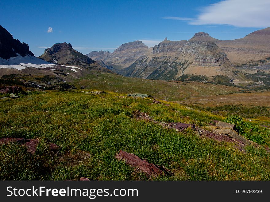 This image was taken from near a climbers path to Mt Reynolds in Glacier National Park and shows the Logan Pass area with the Garden Wall in the background. This image was taken from near a climbers path to Mt Reynolds in Glacier National Park and shows the Logan Pass area with the Garden Wall in the background.