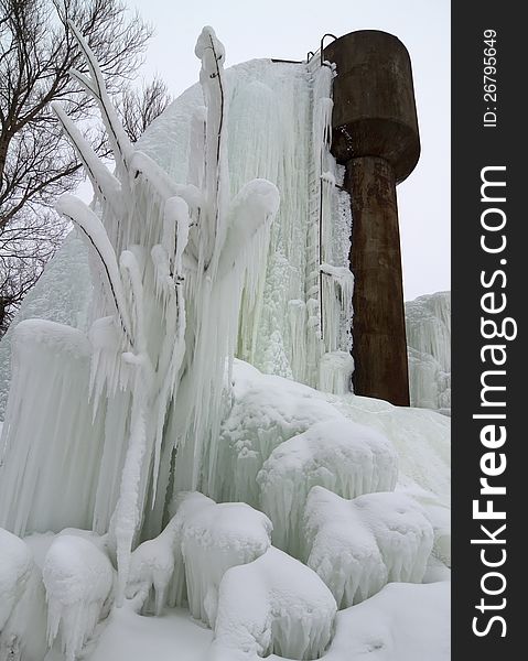 Frozen broken water tower in winter