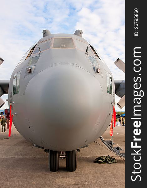 Nose view of Lockheed C-130 Hercules - modern military airplane on the ground. Nose view of Lockheed C-130 Hercules - modern military airplane on the ground