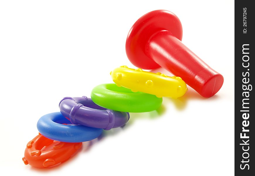 Colorful plastic pyramid toy on white background