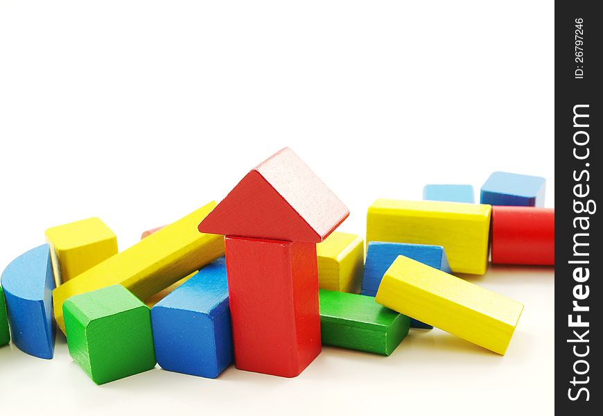 Pile of colorful wooden bricks,  towards white