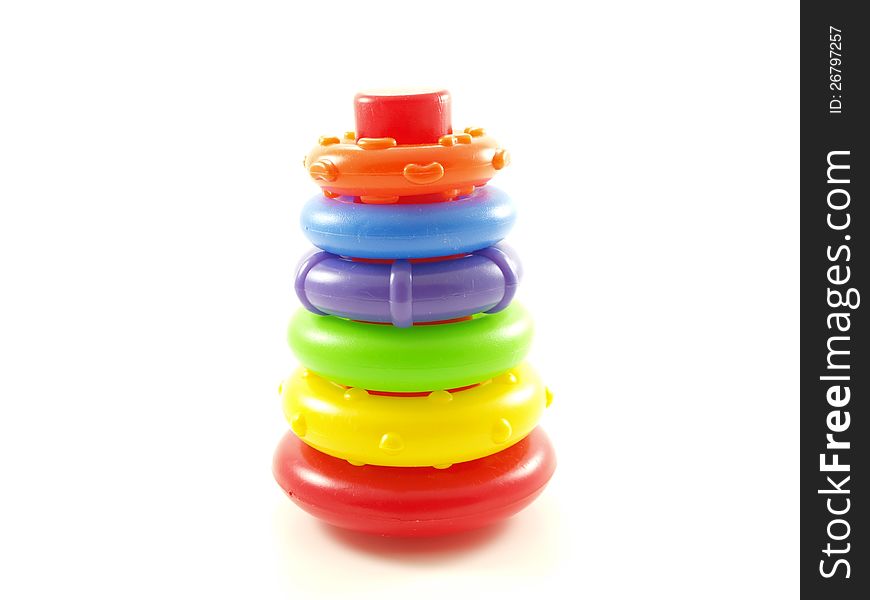 Colorful plastic pyramid toy  on white background