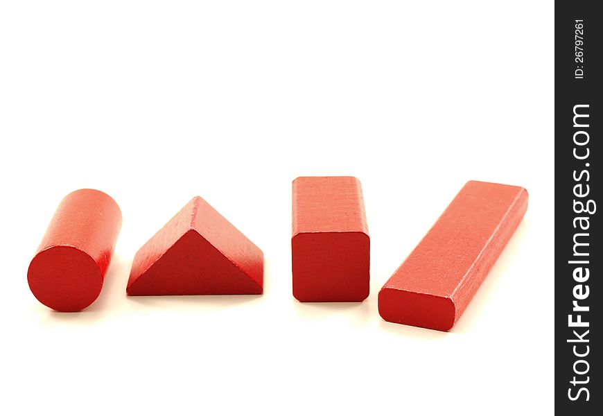 Wooden brick pieces of red color,  towards white. Wooden brick pieces of red color,  towards white