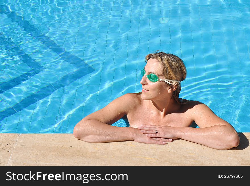 Beautiful girl in a swimming pool