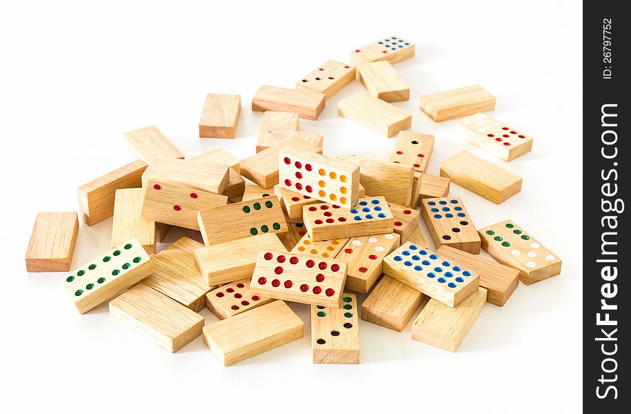 Chaotic heap of wooden domino on white background. Chaotic heap of wooden domino on white background