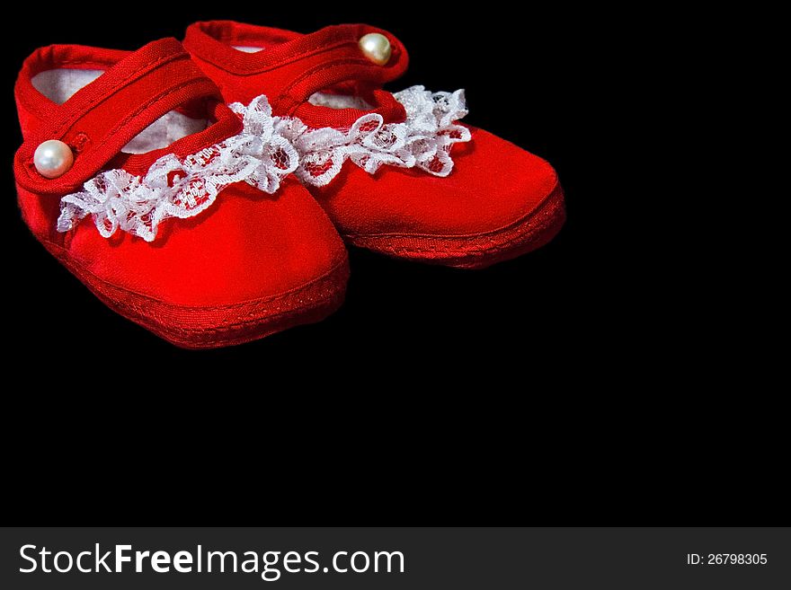 Red baby booties with white lace trim. Red baby booties with white lace trim