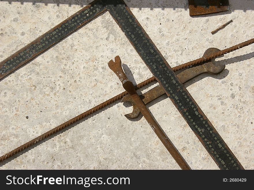 Image of rusty ruler and tools